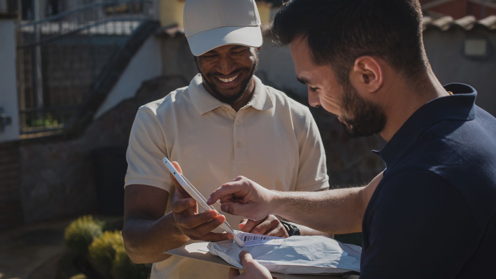 Man delivering package to another man