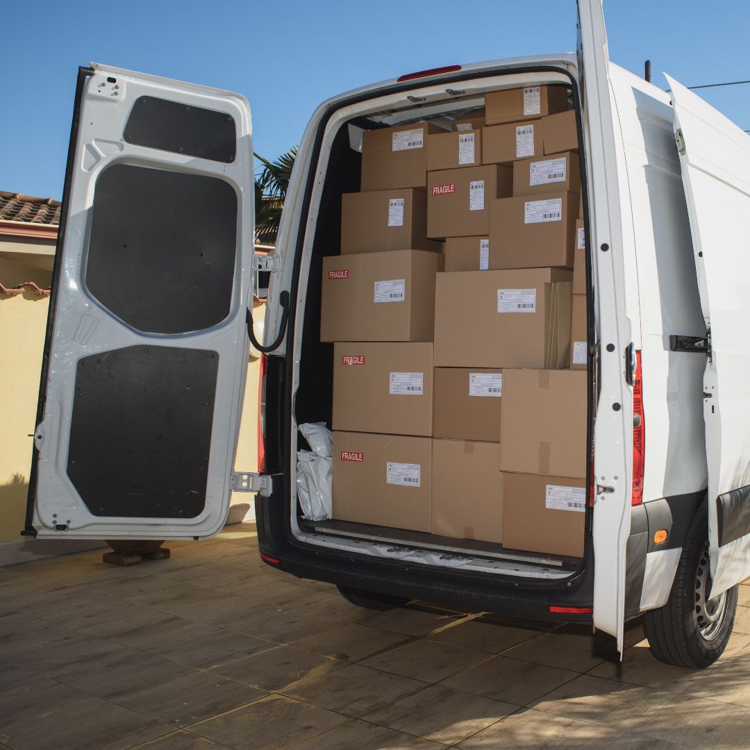 Long-distance courier van filled with packages