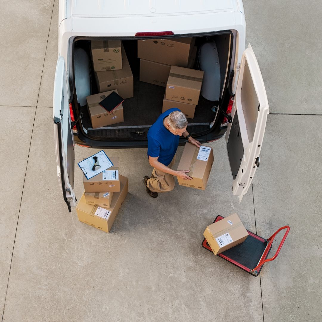 Long-distance courier loading packages for delivery