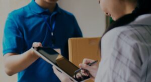 woman signing for delivery